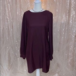 Plum colored long sleeve mini dress with low back